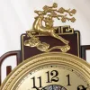 A golden deer-shaped decorative wall clock with a redwood base, a round shell-patterned dial, and Chinese "Fu" character tassels Application Scenario